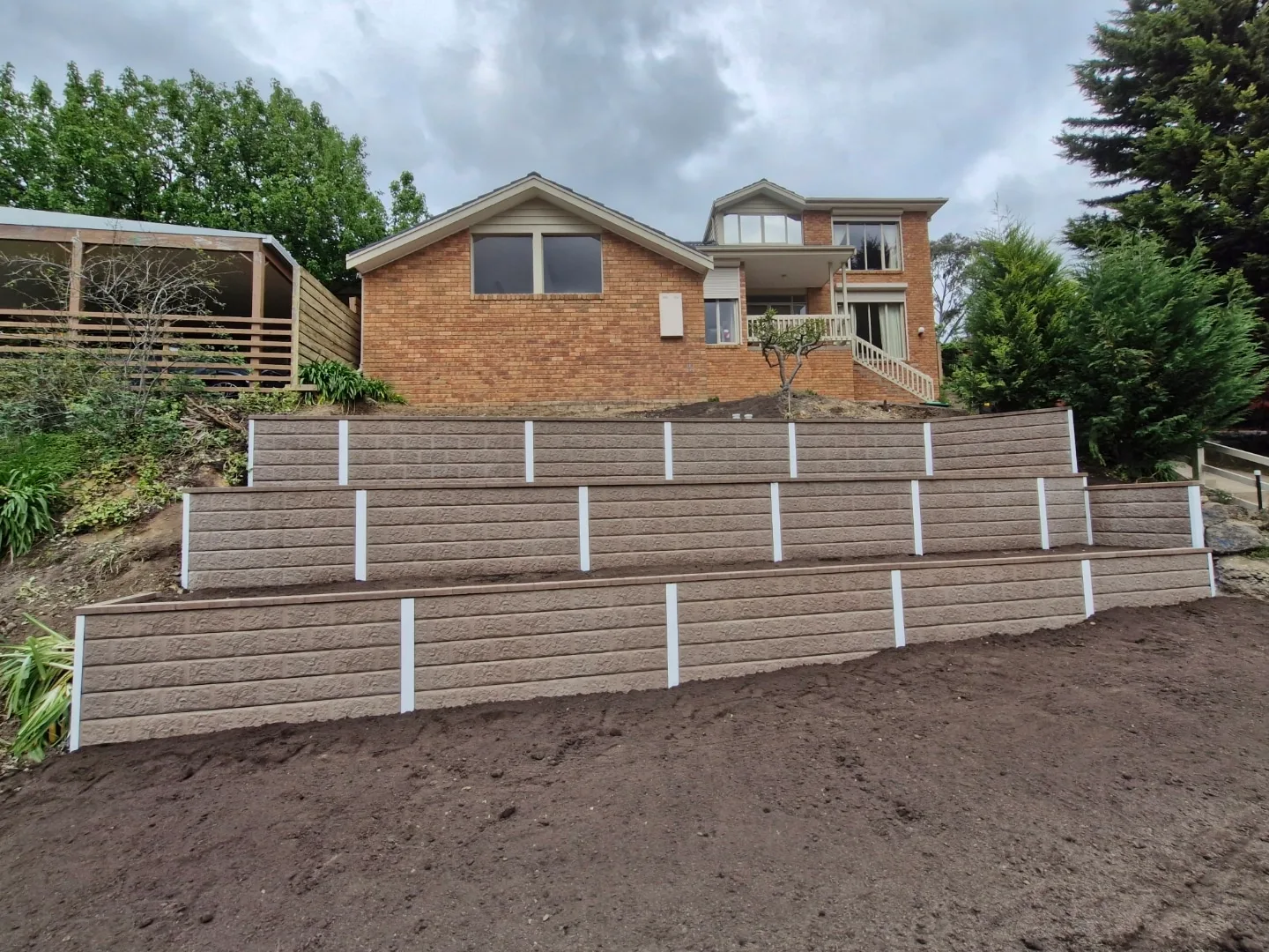 Multi-tiered concrete sleeper retaining wall Melbourne